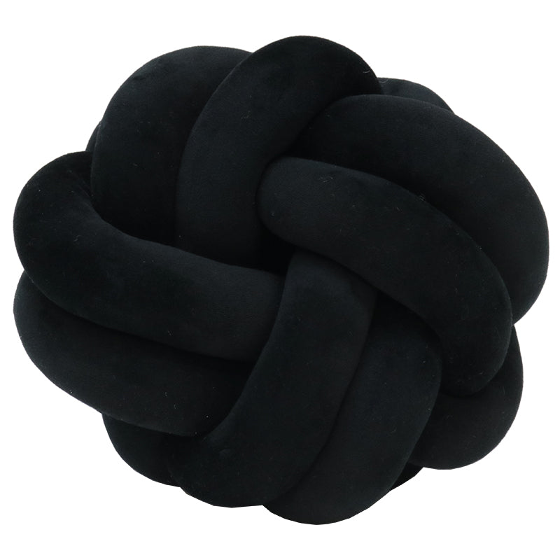 Black velvet knot cushion, the plush braided loops catching soft light against a white background