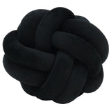 A black Velvet Knot Cushion by Flux Home on a white background.