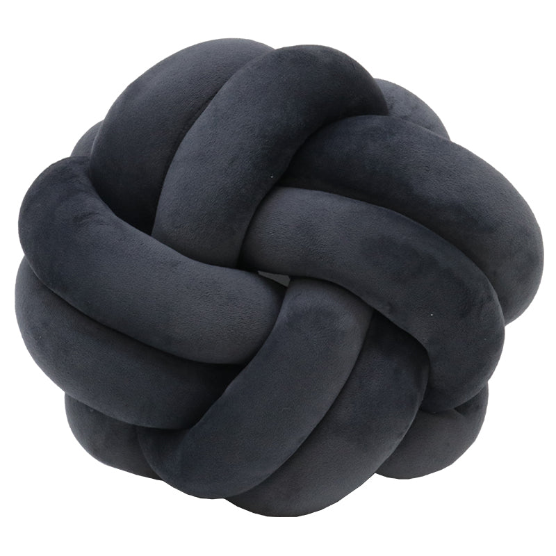 Charcoal grey velvet knot cushion in the same braided knot form, shown on white