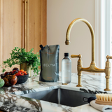 A fragrant kitchen sink featuring a bottle of Ecoya Fragranced Dish Liquid Refill as a stylish home design gift.