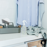 A laundry room with a design and Ecoya Laundry | Linen Spray for an enhanced home fragrance experience.
