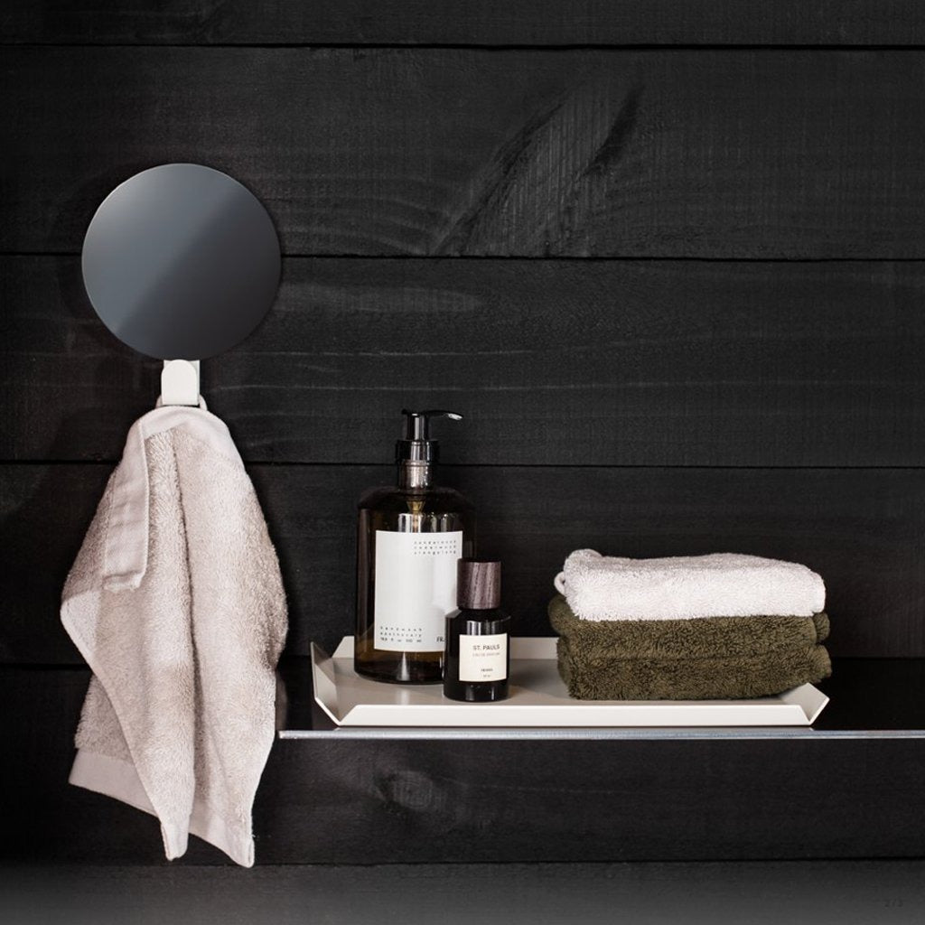 Close up of FOLD Hook Mirror White reflective surface by Made of Tomorrow