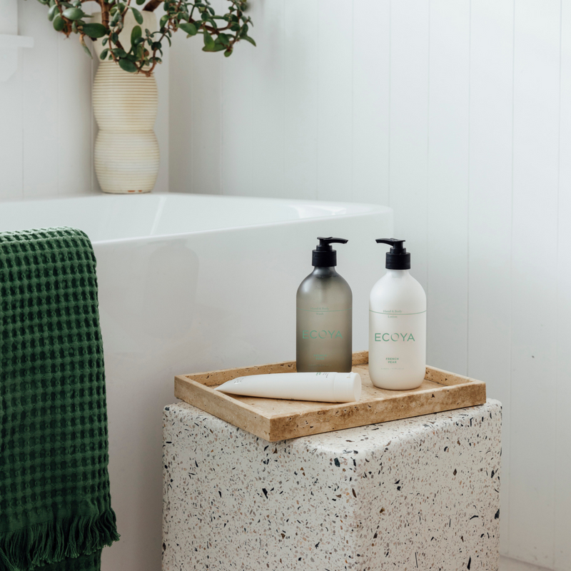 A beautifully designed bathroom featuring an Ecoya fragranced hand and body wash, perfect for gifting.