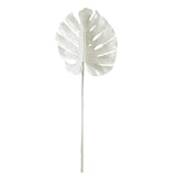 A white split philo leaf on a stick, adding a touch of greenery to your space. (Product Name: White Split Philo Leaf) (Brand Name: Artificial Flora)