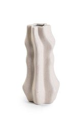 A Limited edition Amelia Ceramic Vase - Small / Large with a wavy shape on a white surface from Bovi Home Collection.