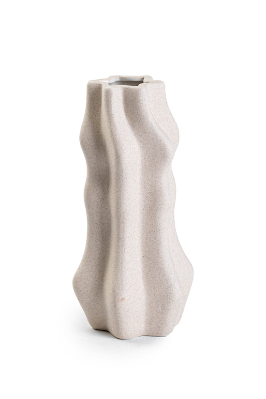 A Limited edition Amelia Ceramic Vase - Small / Large with a wavy shape on a white surface from Bovi Home Collection.