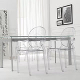 A Casper Dining Chair with Arms and chairs in a white room.