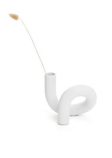 A limited edition Ceramic Pipe Vase White from the Bovi Home Collection with a stick sticking out of it.