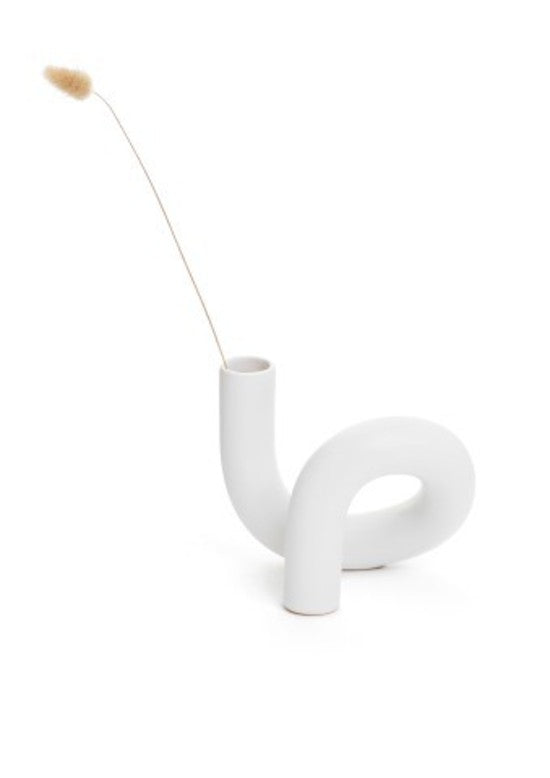 A limited edition Ceramic Pipe Vase White from the Bovi Home Collection with a stick sticking out of it.