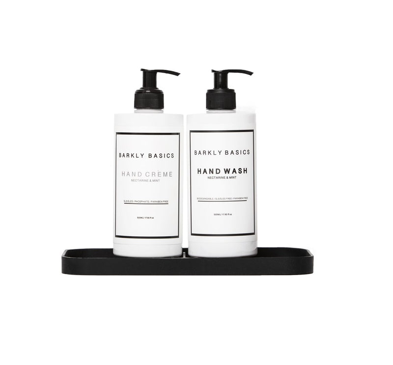 Two bottles of hand soap on a durable Barkly Basics Silicone Decor Tray - Black / Grey.