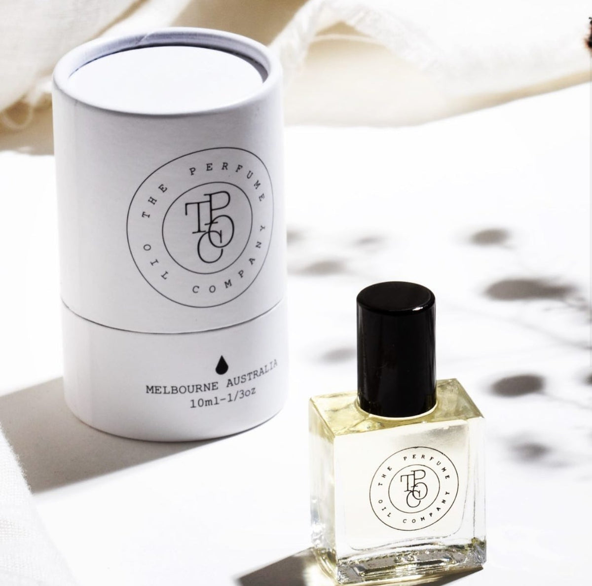 A collection of JETT perfume oils with a box next to them, offering a variety of fragrances. Inspired by Black Orchid (Tom Ford), from The Perfume Oil Company.