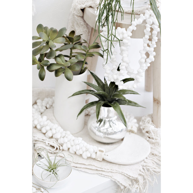 A table with Desert Plants and Artificial Flora floral styling.