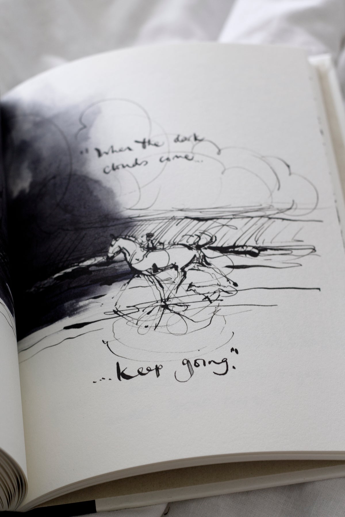 An open Charlie Mackesy | The Boy, The Mole, The Fox and The Horse book.