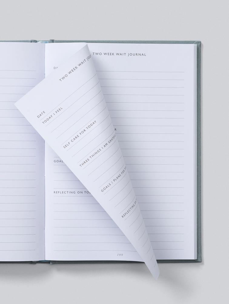 Journal pages turning to show lined journal prompts