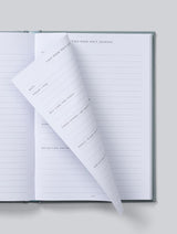 An IVF JOURNAL | Grey by Write To Me, an open notebook with a piece of paper on it, specifically designed for an IVF journal.