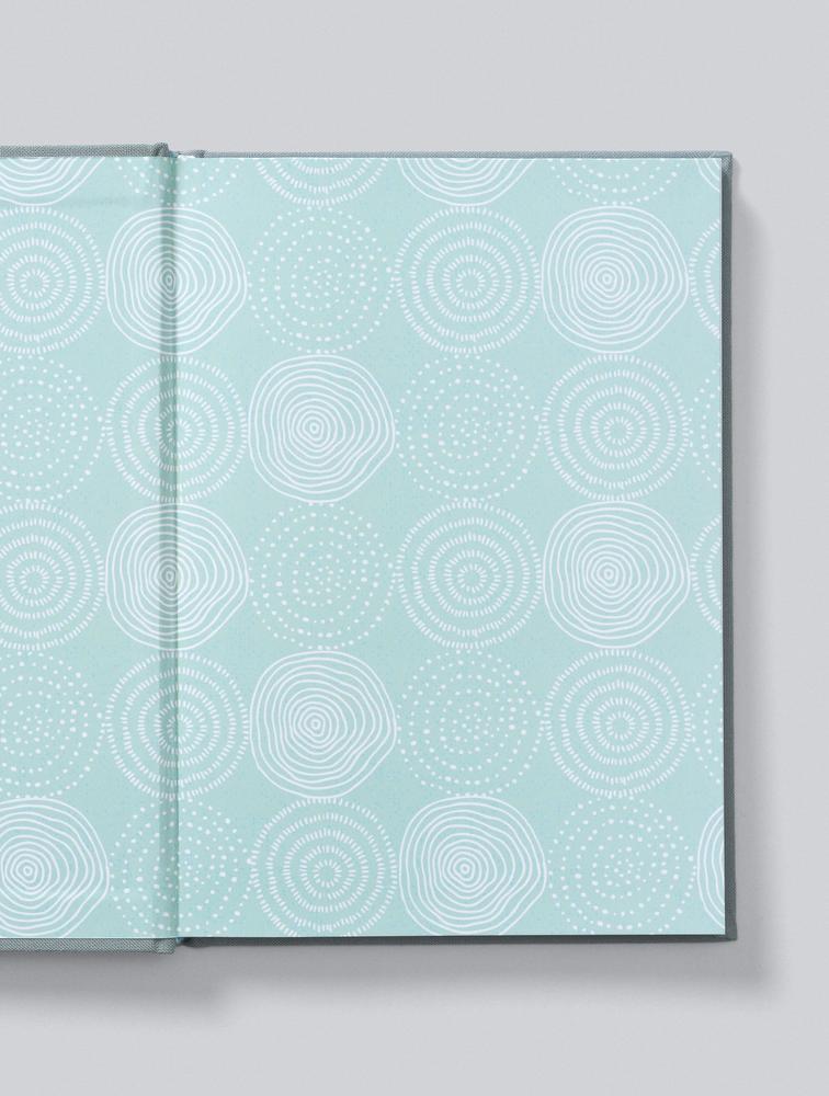 IVF Journey Journal open to its mint patterned endpapers
