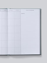 An IVF JOURNAL | Grey by Write To Me, with a calendar on it for treatment monitoring during IVF planning.