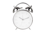 A minimalist Karlsson Alarm clock in silver steel on a white background with Scandinavian influences.
