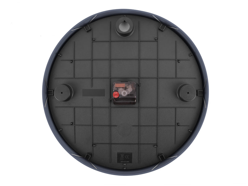 The back of a Karlsson wall clock in black with an aesthetic red button.