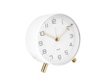A Lofty Alarm Clock with Light - White by Karlsson, with gold legs on a white background featuring silent movement.
