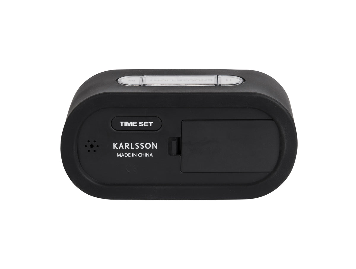 Back of the black Karlsson Gummy alarm clock showing the battery compartment