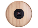 Aesthetic Pure speaker with a black button on it, designed by Karlsson.