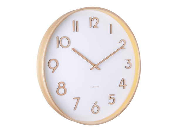 A Karlsson wall clock with gold numbers, showcasing pure design and Scandinavian influences.