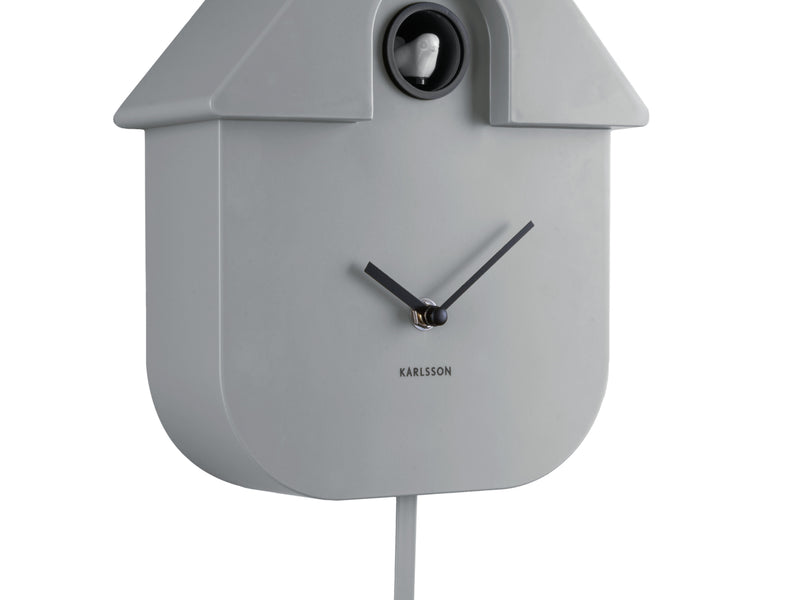 A modern grey clock with a house design by Karlsson.