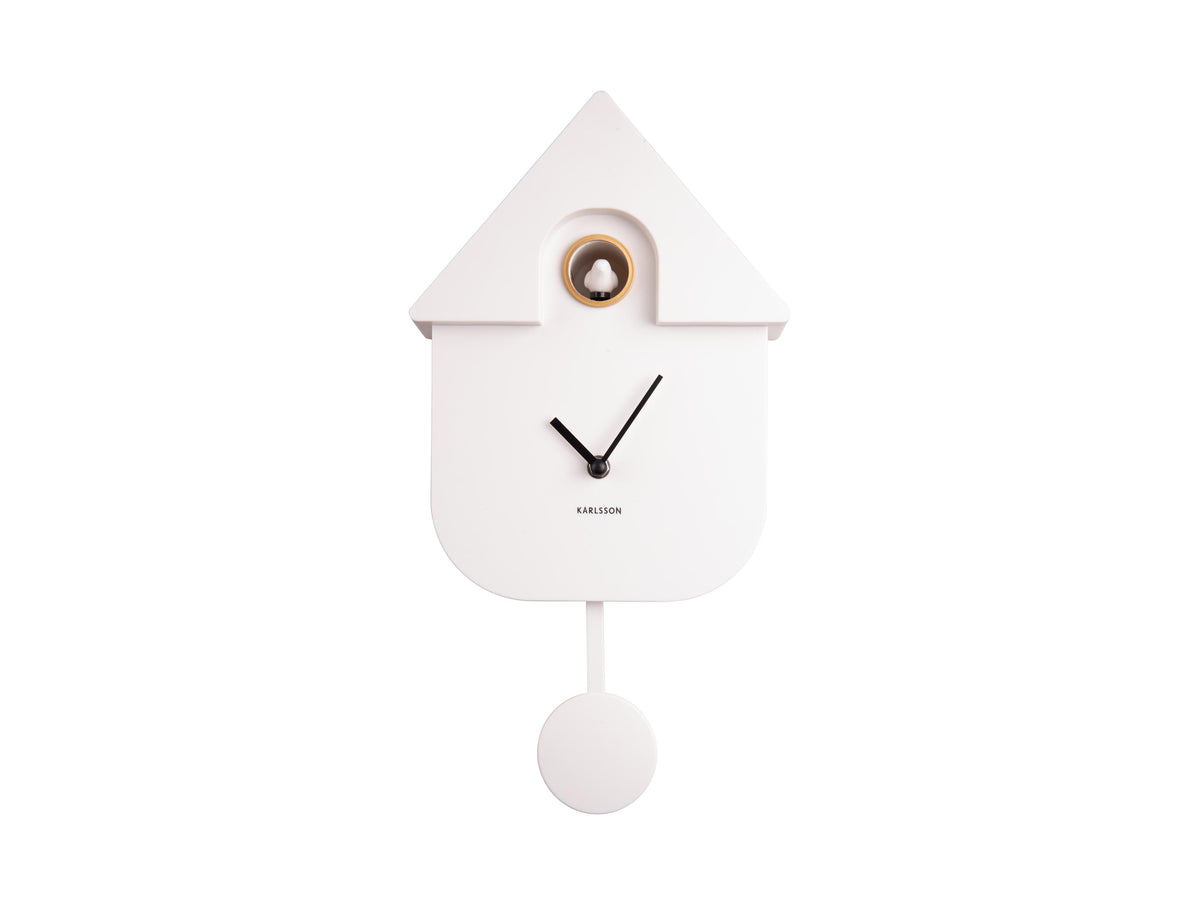 Karlsson Modern Cuckoo Clock in white mounted on a plain wall