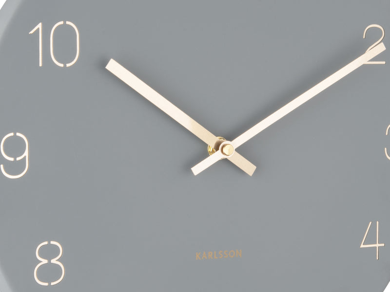 A Karlsson Charm Wall Clock - Various Colours with gold hands.