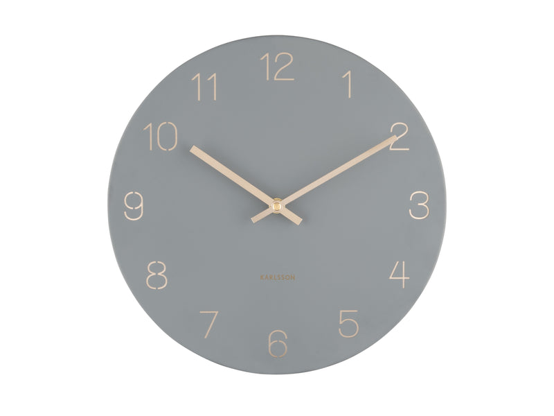 A Karlsson Charm Wall Clock with gold hands and engraved gold numbers.