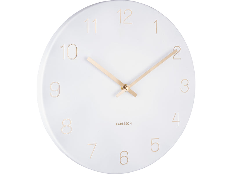 A Karlsson Charm Wall Clock - Various Colours featuring gold hands and engraved gold numbers on a white background.