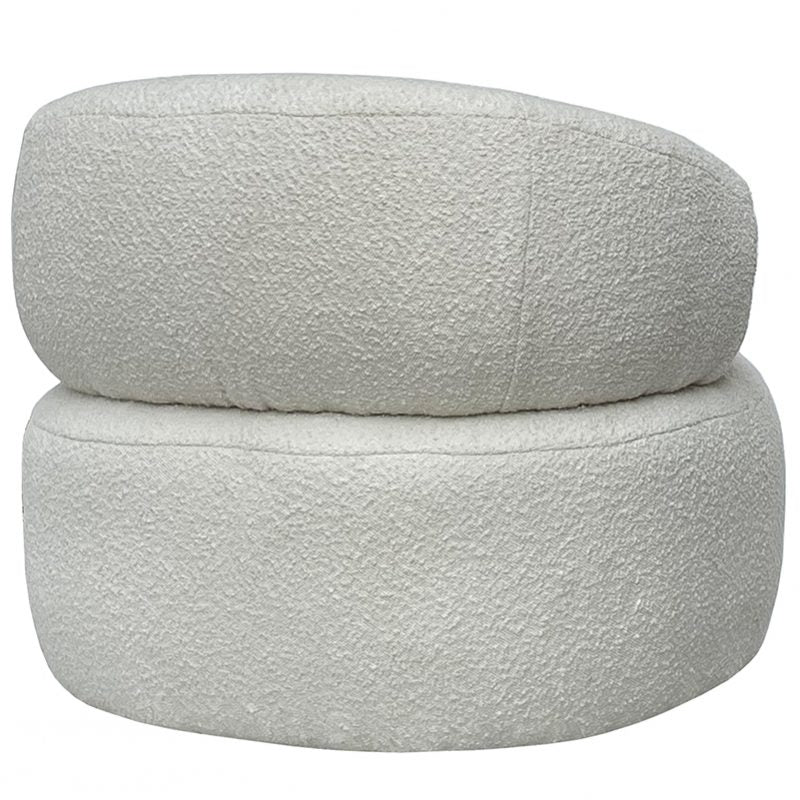 Rear view of the boucle armchair, the back cushion sitting above the round base