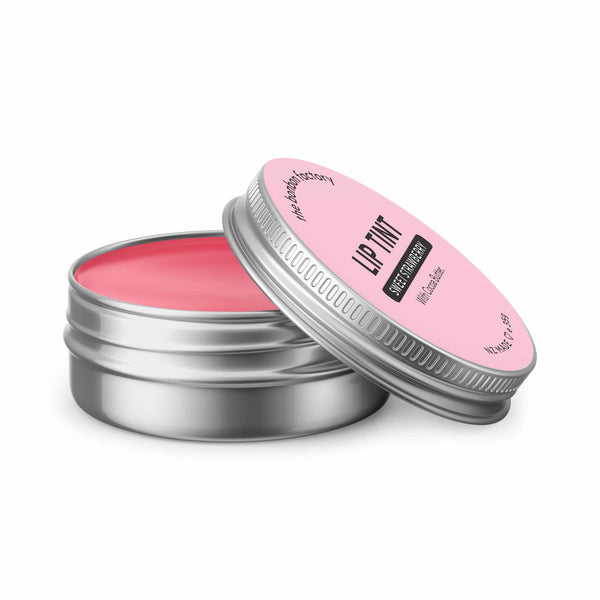 A SWEET STRAWBERRY | LIP TINT tin in pink on a moisturizing white background from The Bonbon Factory.