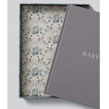 A limited edition Mrs Mighetto X Write To Me Baby Journal in a box with the word "baby" on it.