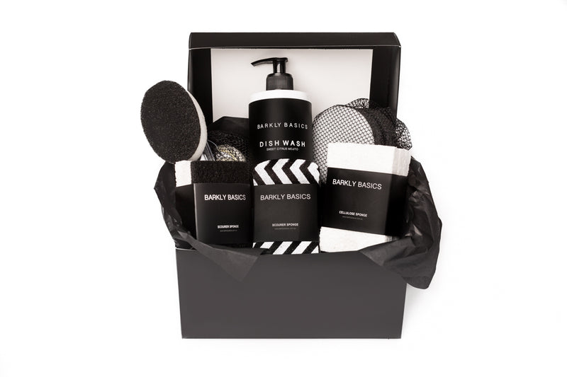 A stylish black gift box filled with various stylish kitchen accessories, including re-usable mesh bags and Barkly Basics Black Dish Stick Refill Heads - Pack of 3.
