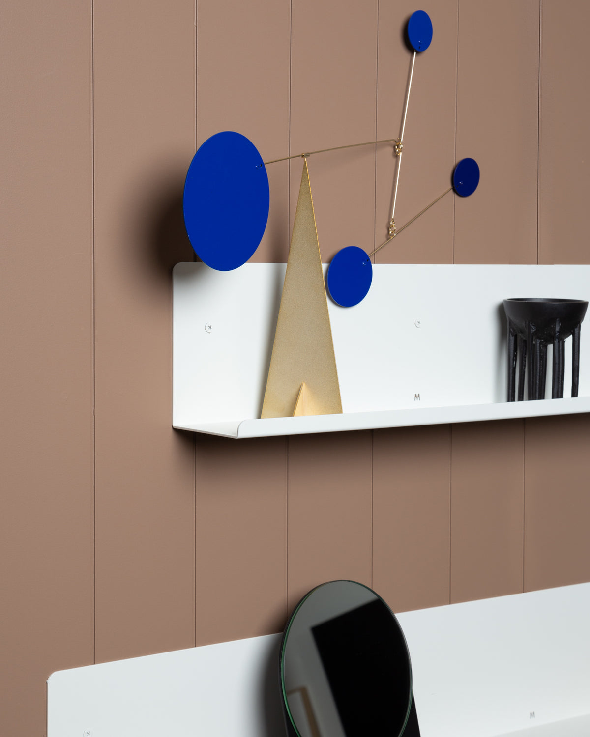 A FOLD Display Ledge 600mm ∙ White by Made of Tomorrow with blue and white objects on display space.