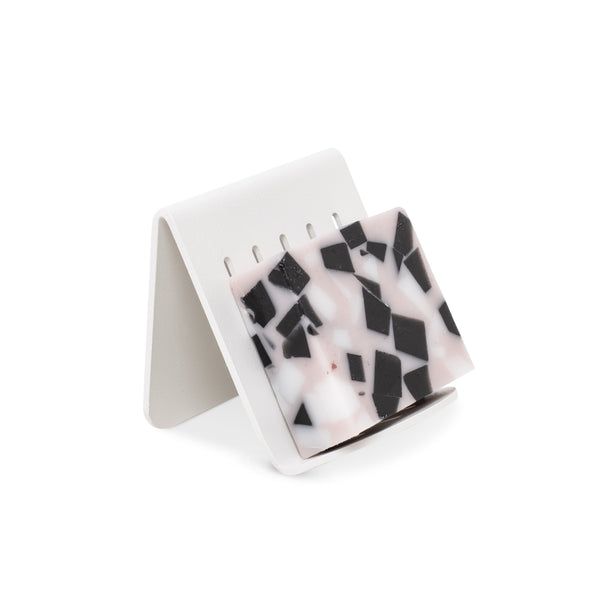 A FOLD Soap Block Holder ∙ White by Made of Tomorrow with black and white marble on it.