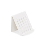 A FOLD Soap Block Holder ∙ White from Made of Tomorrow on a white surface.