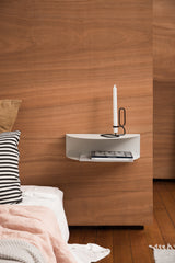 A FOLD Bedside Table ∙ White by Made of Tomorrow in a small bedroom.