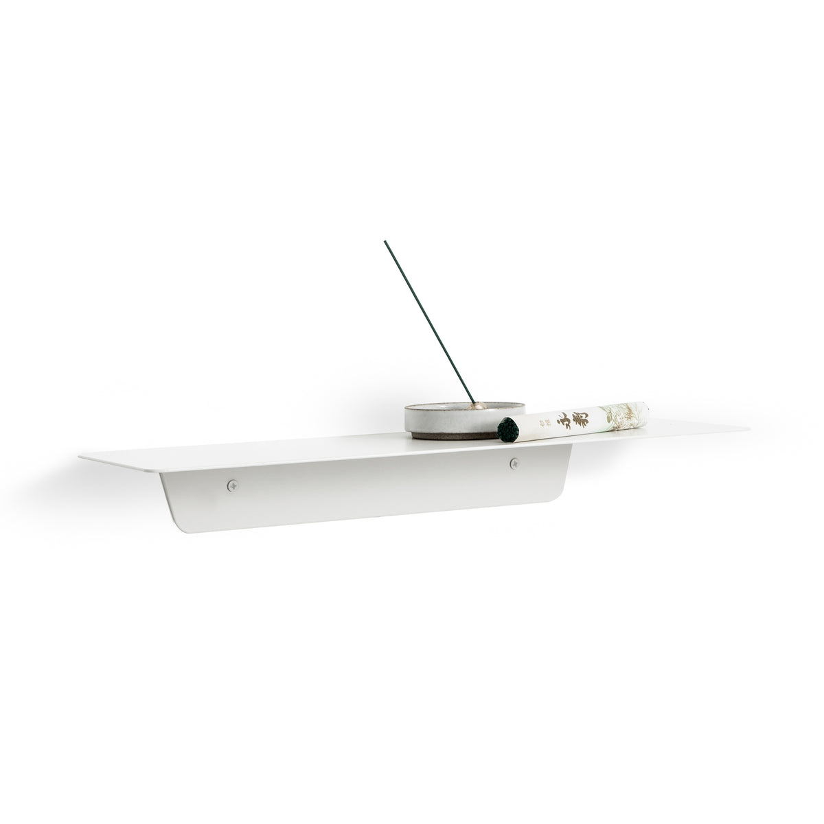 A functional FOLD Ledge 450mm ∙ Black shelf with a phone resting on the Made of Tomorrow branded box.