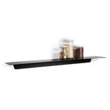 The FOLD Ledge 900mm ∙ White, made by Made of Tomorrow, is a sleek black shelf that beautifully displays an assortment of kitchen objects such as jars and nuts.