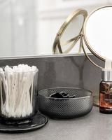 A bathroom with a mirror, toothbrushes and Umbra Allira Organizer - Smoke that is perfect for everyday personal hygiene.