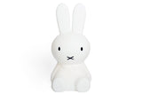 A medium-sized white bunny sitting on a white surface with a Mr Maria Miffy Star Light - DIMMABLE, MOOD LIGHTING.