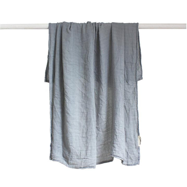 A Bamboo Blend Swaddle - Mist made by Bengali Collections hanging on a clothesline.