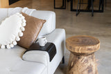 A white ARM CHAIR SIDE REST with pillows and a coffee table from Ned Collections.