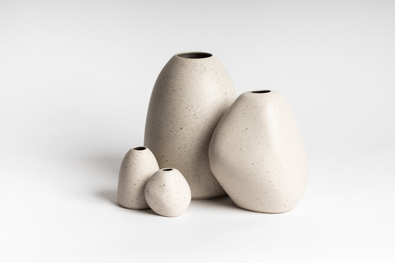 A collection of HARMIE Pebble Vases - Natural, incorporating the artistic touch of Vietnamese artisans, by Ned Collections.