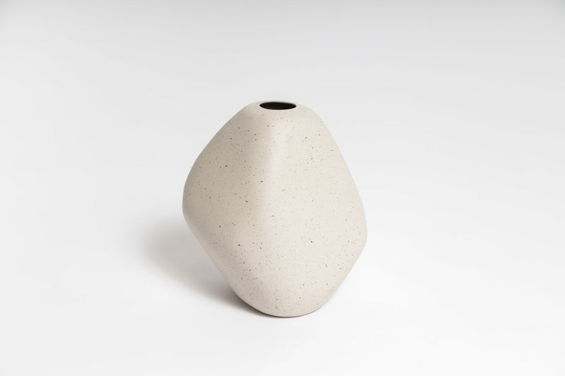 A white Harmie Vase - Various Options sitting on a white surface.