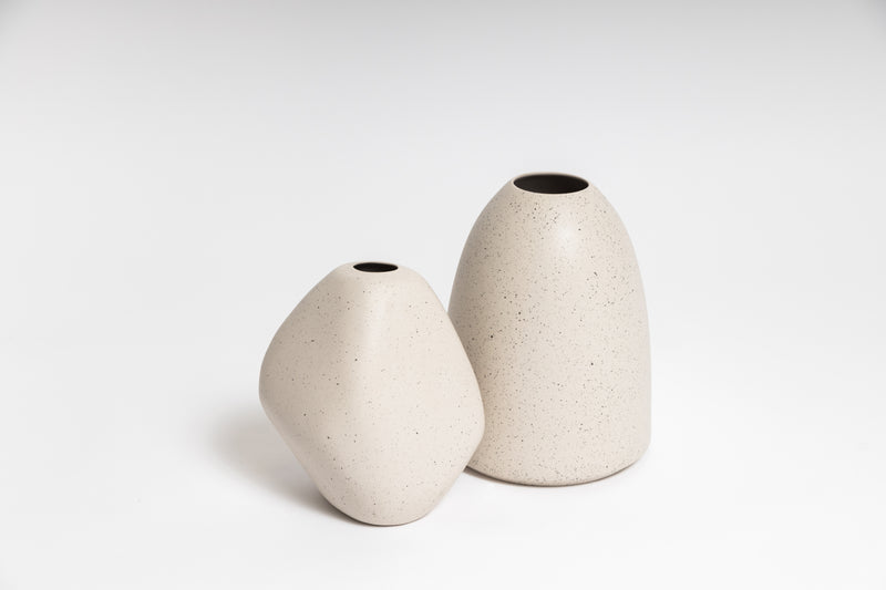 Two white HARMIE Pebble Vases by Ned Collections on a white background, exuding a hand-crafted feel crafted by Vietnamese Artisans.