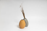Ned Collections presents a SPECIAL ORDER ITEM featuring two Harmie Vases adorned with dried grass on a white background.